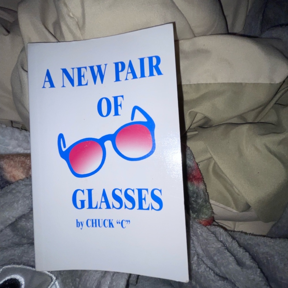 Book, a new pair of glasses, used- good condition
